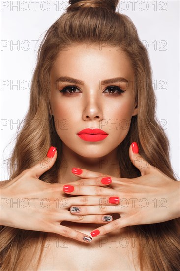 Beautiful young woman with bright makeup and neon pink nails. Beauty face. Photo taken in the studio