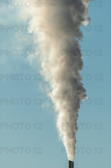 Column with smoke coming out of an industrial chimney. France