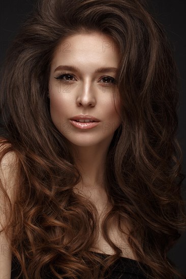 Beautiful brunette model with volume curls