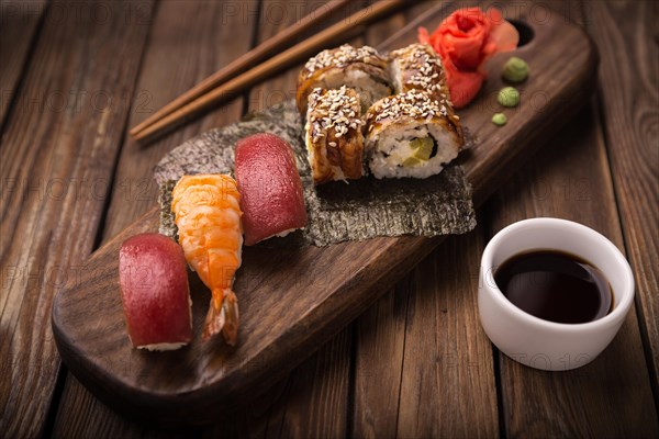 Sushi set on a wooden tray. Photo shot in studio