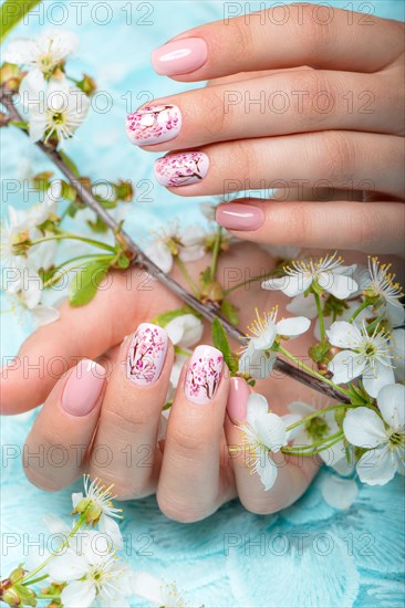 Spring manicure for the bride in gentle tones with flowers. Nail Design