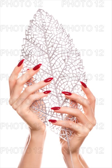 Bright festive red manicure on female hands. Nails design