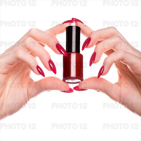 Bright festive red manicure on female hands. Nails design