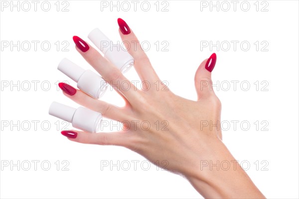 Bright festive red manicure on female hands. Nails design