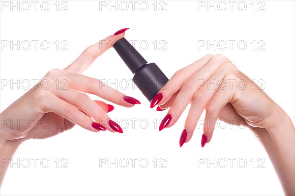 Bright festive red manicure on female hands. Nails design