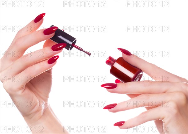 Bright festive red manicure on female hands. Nails design