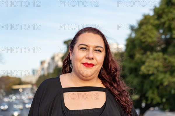 Portrait of a smiling plus-size woman looking at camera