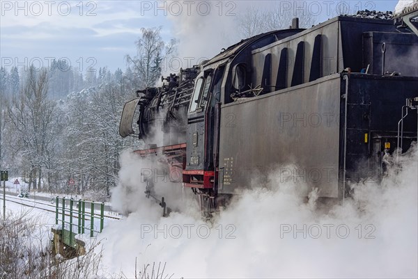 Steam train of the Swabian Alb Railway with steam locomotive 052740-8 on the line between Muensingen and Engstingen