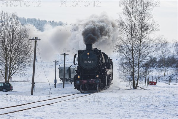 Steam train of the Swabian Alb Railway with steam locomotive 052740-8 on the line between Muensingen and Engstingen