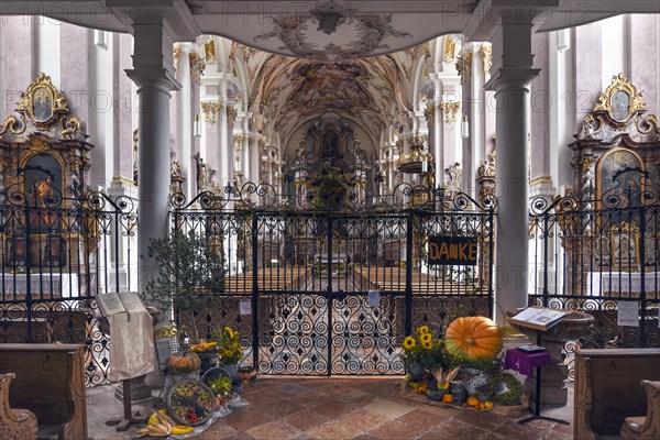 Harvest decoration in front of the baroque interior of the former monastery church of St. Margareta