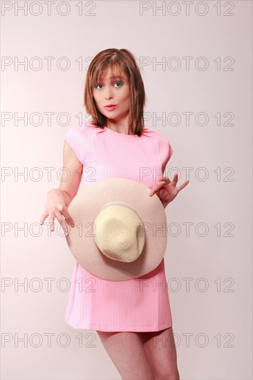 Woman with hat in hand