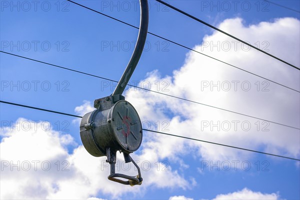 Ski lift at standstill due to lack of snow caused by climate change at the end of winter on a hill in Muensingen