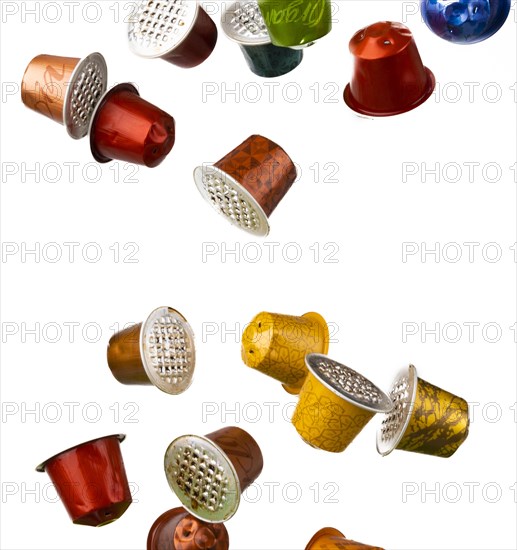 Different coloured used coffee capsules