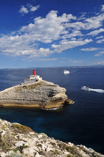 The lighthouse Phare de la Madonette at the harbour entrance of Bonifacio