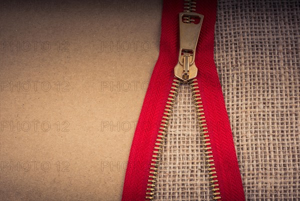 Closeup of a colorful zipper on linen canvas