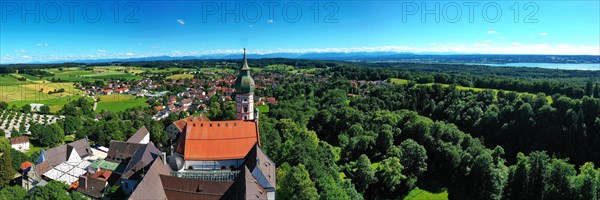 Aerial view of Andechs Monastery with the Alps in the background. Andechs