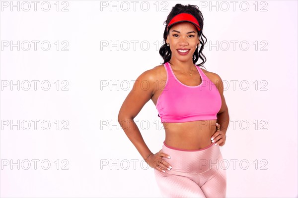 Black ethnic woman in a zumba training on a white background