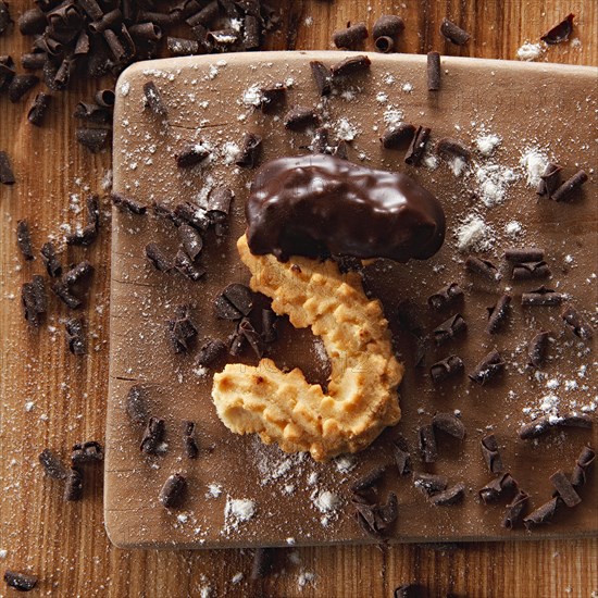 Shortbread with chocolate on wood