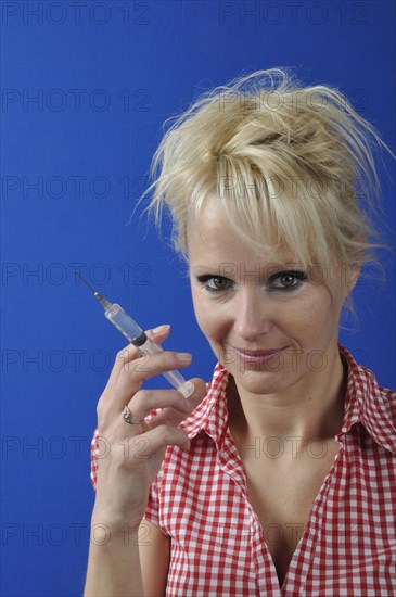 Portrait of Nurse Holding a Syringe