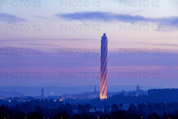Test tower of TK-Elevator in the early morning. Express and high-speed lifts are tested in the 246-metre-high tower. Behind it, the city with its historic towers and churches. Rottweil, Baden-Wuerttemberg, Germany, Europe