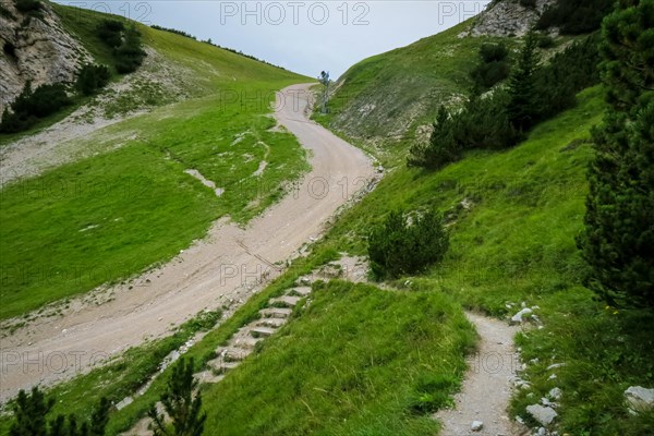 Steep road for car transport running through the mountains in the Dolomites. Dolomites, Italy, Dolomites, Italy, Europe