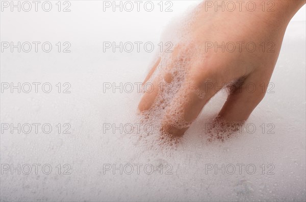 Hand washing and soap foam on a foamy background