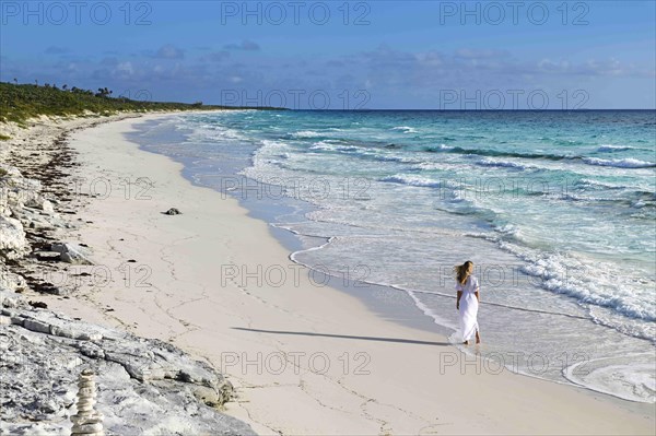 Tourist on the beach of Highbourne Cay