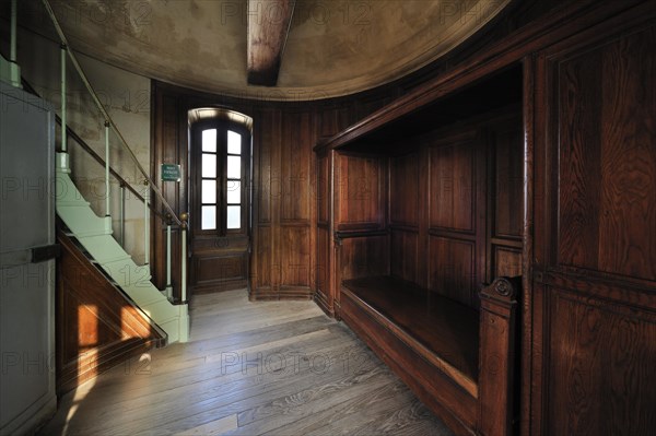 Wooden bed in bedroom inside the lighthouse Phare des Baleines on the island Ile de Re