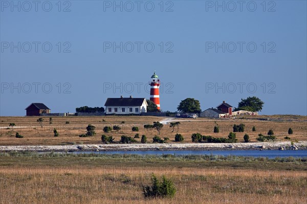 The red and white lighthouse Naers fyr at Naersholmen on the island Gotland