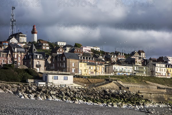 View over the houses and lighthouse of the village Ault seen from the beach