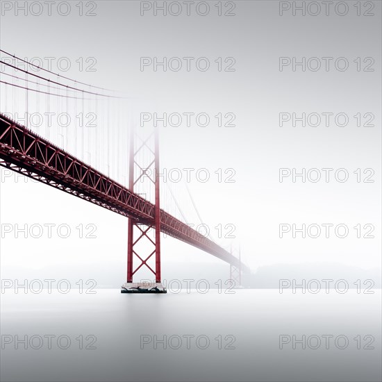 Minimalist long exposure of the Golden Gate Bridge's little sister. The Ponte 25 de Abril bridge over the Tagus River in Lisbon