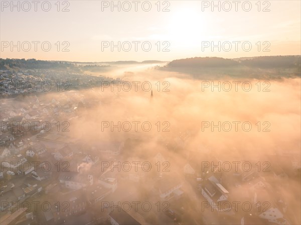 City in the fog at sunrise