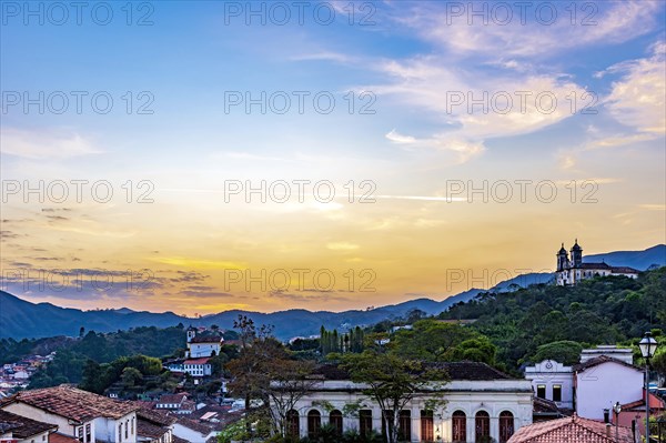 View of old houses and churches in colonial architecture from the 18th century at sunset in the historic city of Ouro Preto in Minas Gerais