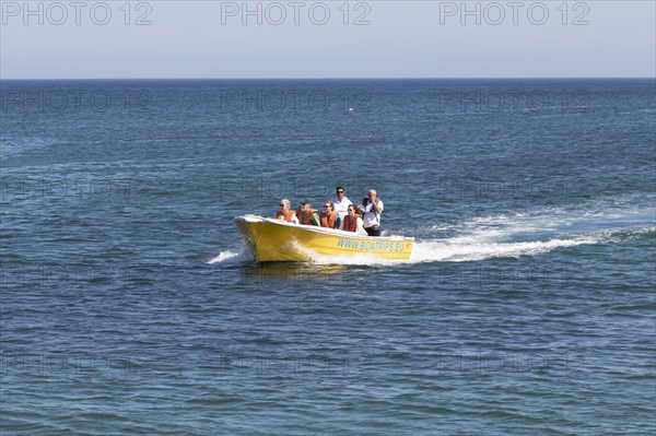 Motorboat with tourists on a boat trip in the Atlantic Ocean off the coast of Lagos