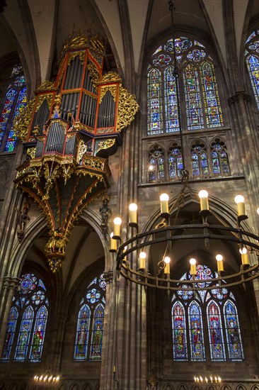 Suspended pipe organ and stained glass windows in the Cathedral of Our Lady of Strasbourg