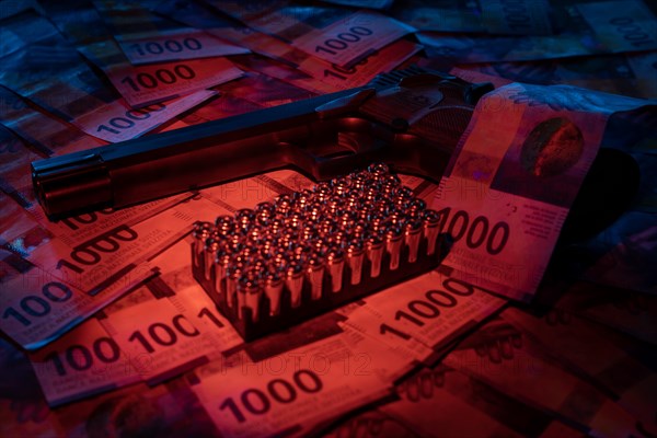 Elegant Semiautomatic 9mm Handgun with Swiss Helvetia Symbol Leaning on Swiss Franc 1000 Banknote and Bullet Ammunition in Switzerland