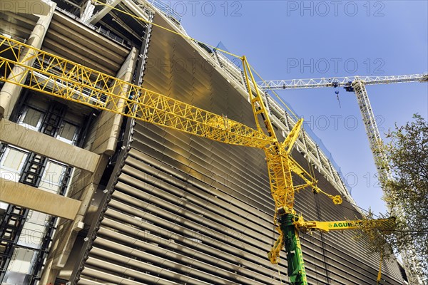 Construction crane in front of Real Madrid football stadium