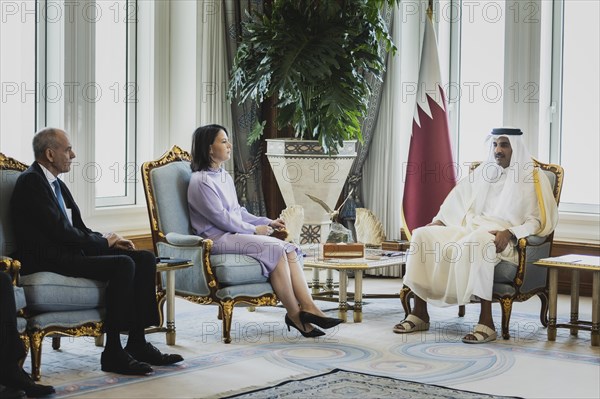 (L-R) Annalena Baerbock (Buendnis 90 Die Gruenen), Federal Minister for Foreign Affairs, and Sheikh Tamim bin Hamad bin Khalifa Al Thani, Emir of the State of Qatar, photographed during a joint meeting in Doha, 17 May 2023. Baerbock is travelling to Saudi Arabia and Qatar on her three-day trip., Doha, Qatar, Asia