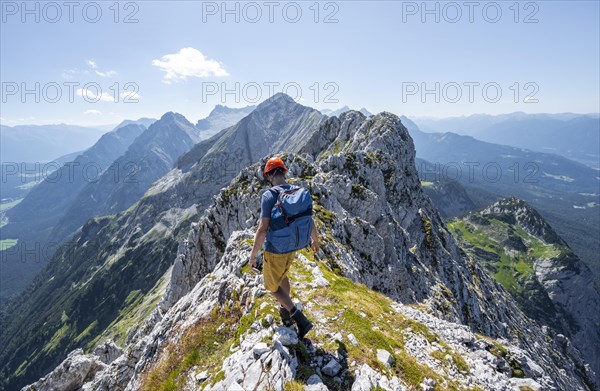 Climbers at the summit of the Upper Wettersteinspitze