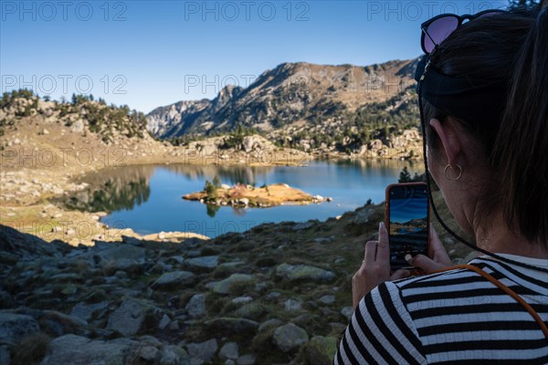 Woman taking a picture with her smartphone