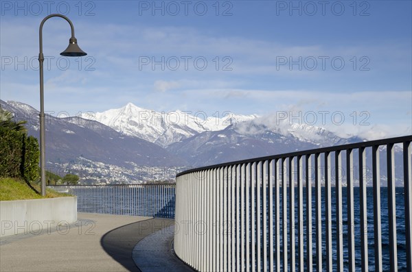 Waterfront with fence and street lamp