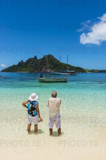 Tourists enjoying the beautiful clear turquoise waters of Monuriki or Cast away island