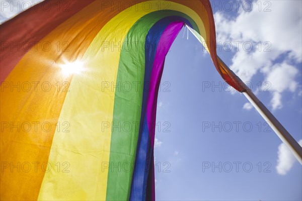 A rainbow flag waves