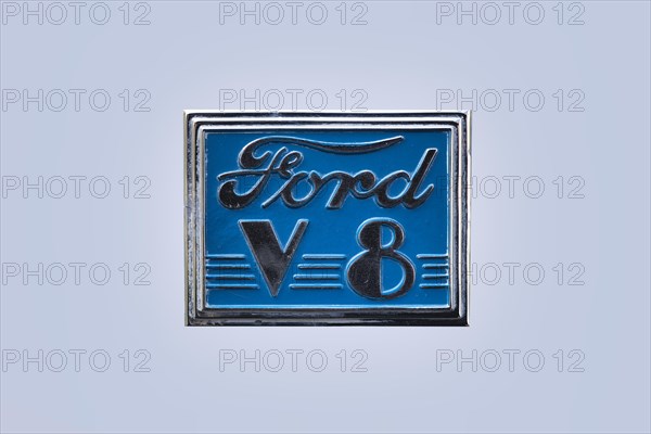 Blue vintage Ford V8 logo