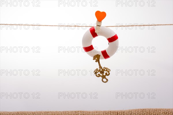 Life preserver attached to a string with heart icon