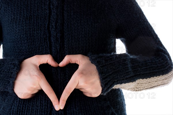 Hand making a heart on a white background