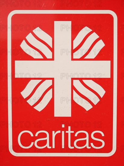 Sign with inscription Caritas