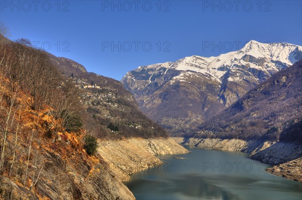 Alpine Lake and Snow-capped Mountain in Valley Verzasca in Ticino