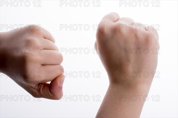 Clenched fists on a white background