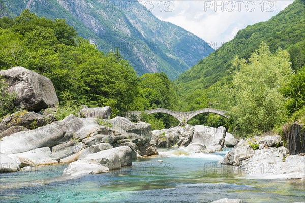 River in Valley Verzasca and Bridge Ponte dei Salti with Mountain in a Sunny Day in Ticino